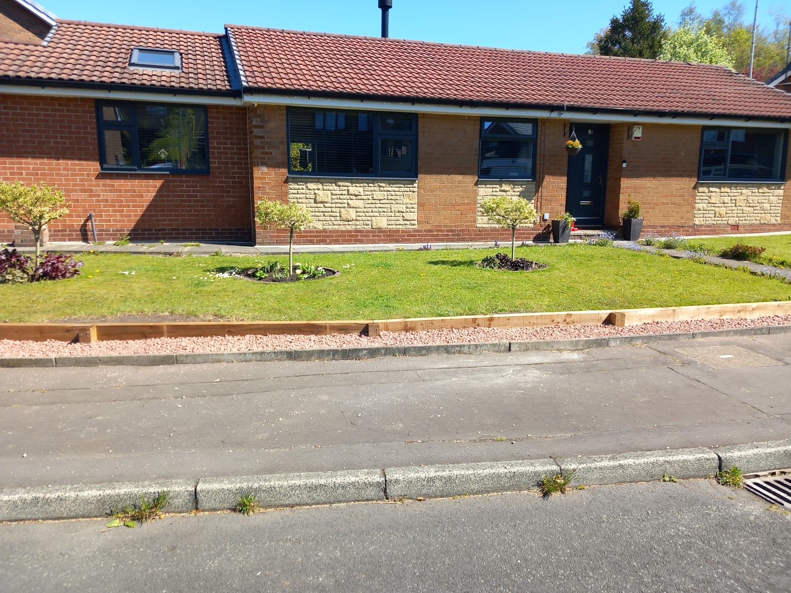 Landscaped lawn and planting beds